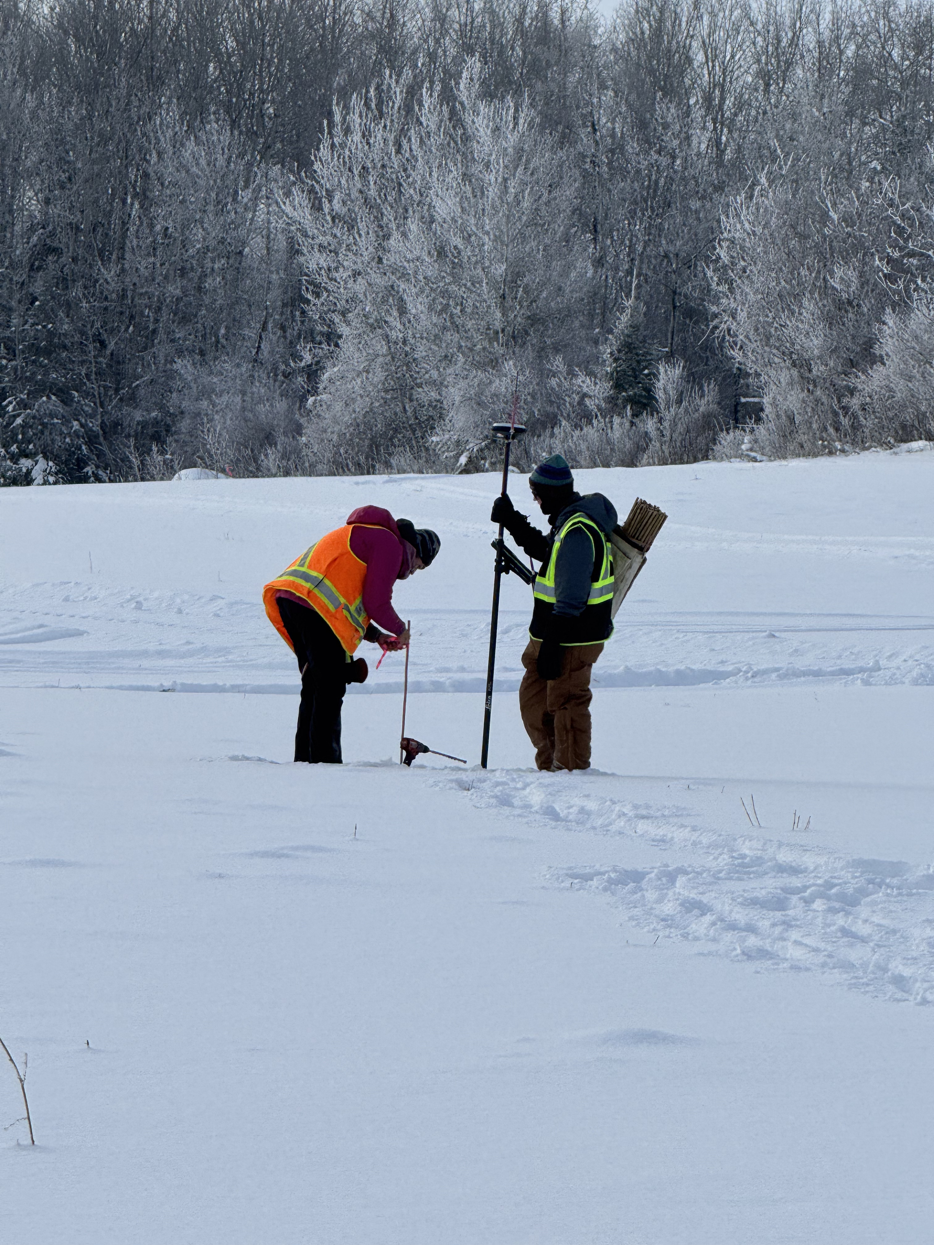 Crew staking a point in deep snow